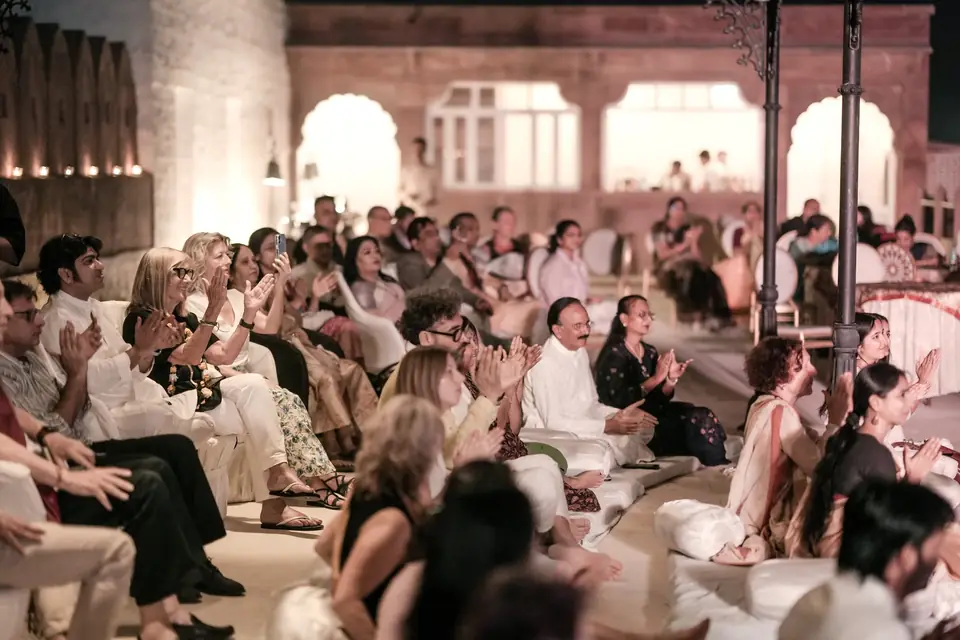 The audience applauding at the night concert