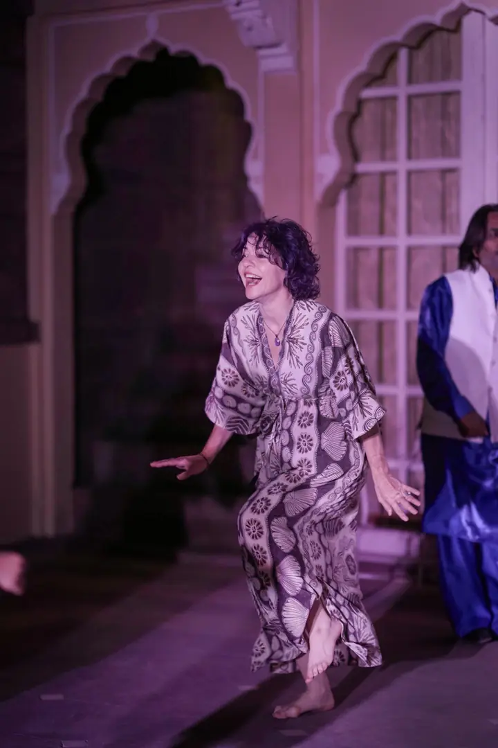 A guest dancing in the courtyard after the concert