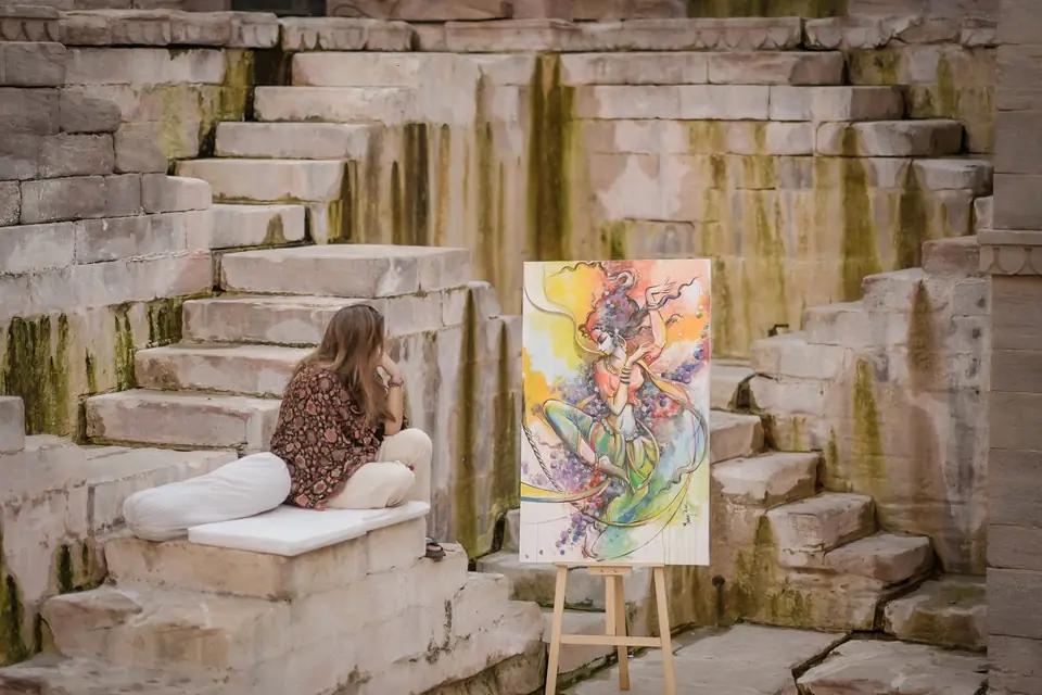 A painting on an easel among the steps