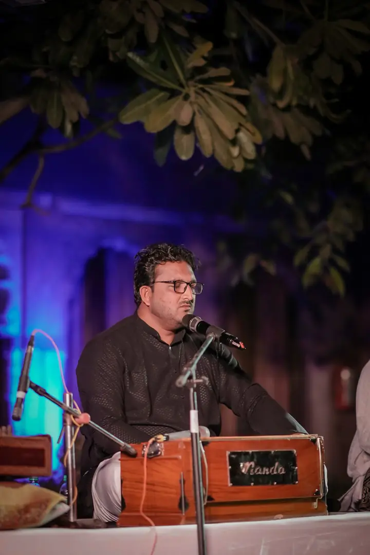 A singer at the harmonium