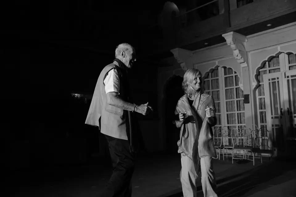 Two guests dancing in the courtyard