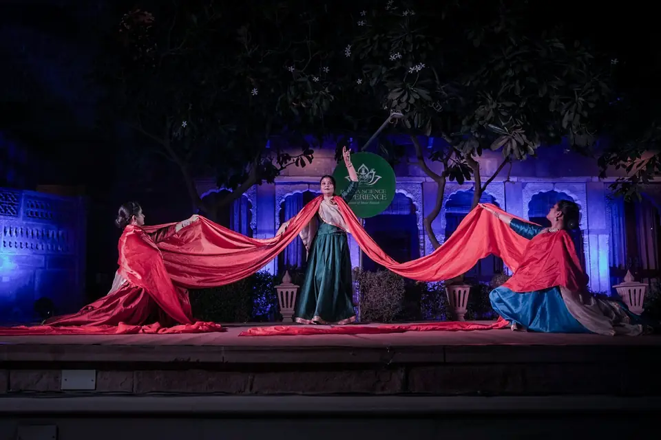 Kathak dancers with a long red cloth on the main stage