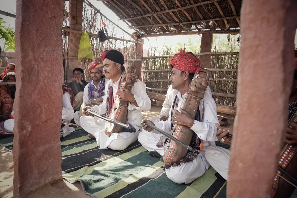 Two musicians with bowed folk instruments