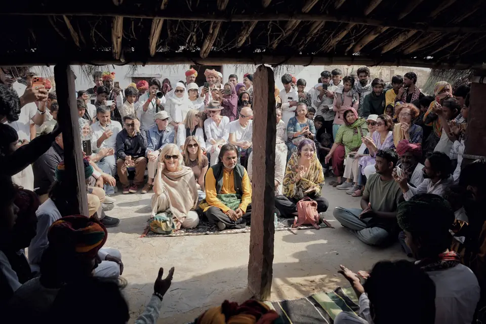 Guests and villagers crowded into the shelter to listen