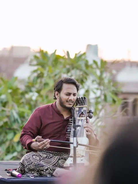 Ayan Khan playing sarangi
